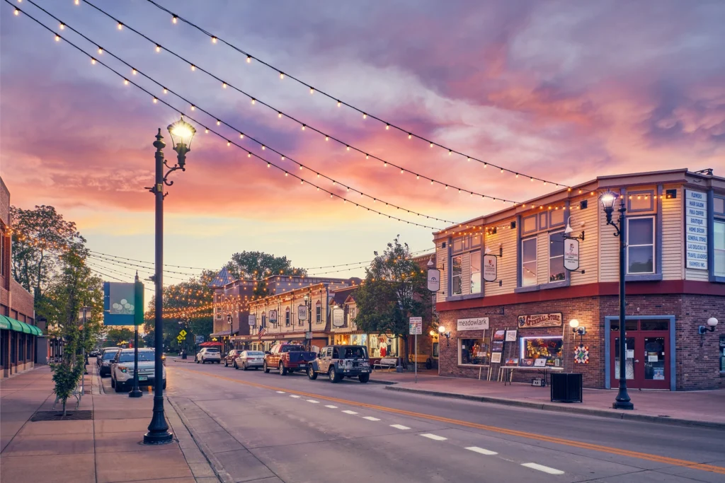 Scenic view of downtown Parker, Colorado at sunset with street lights and colorful sky