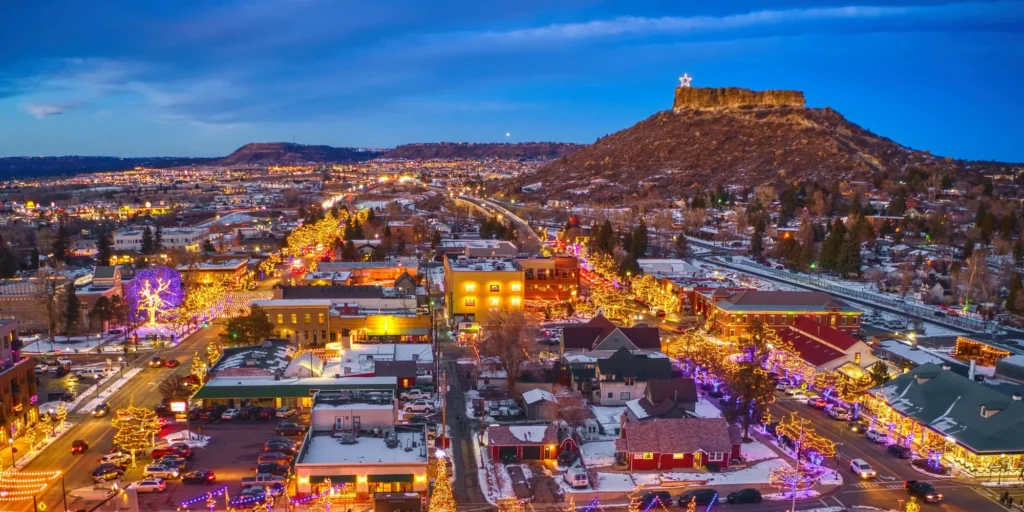 Aerial view of Castle Rock, Colorado at night with festive lights