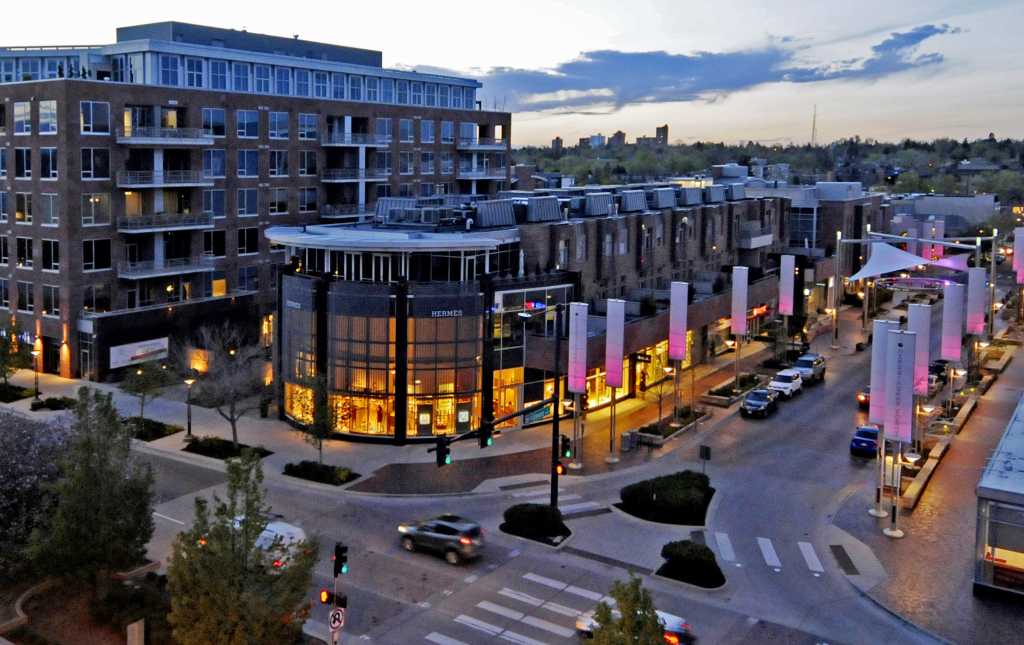 Aerial view of Fillmore Plaza at dusk in Cherry Creek North with modern buildings and street lights