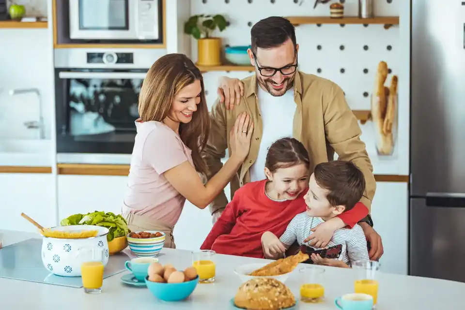 Family enjoying breakfast together in a modern kitchen