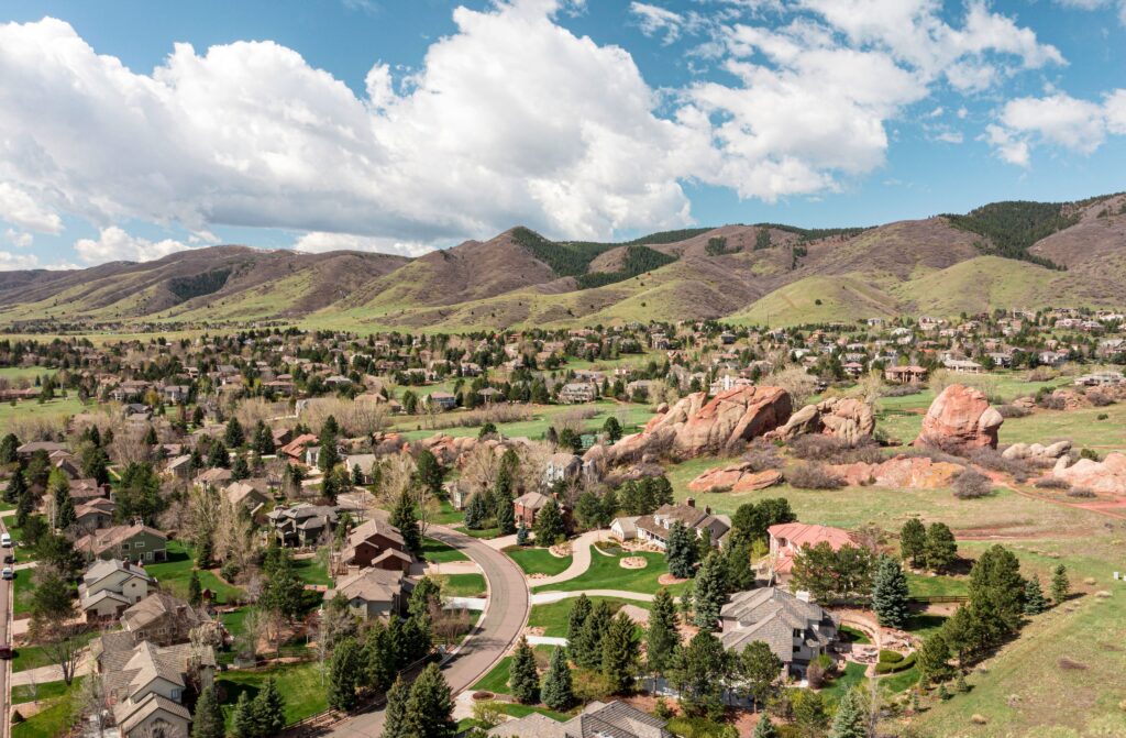 Aerial view of Ken Caryl, Colorado with lush greenery and mountain backdrop
